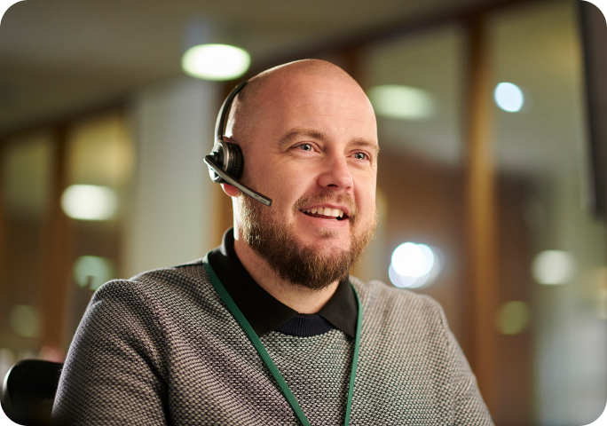 Man using headset to talk to clients